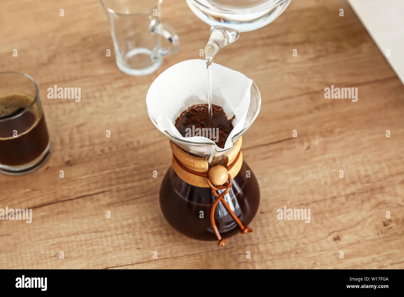 Preparing of tasty coffee in chemex on table Stock Photo