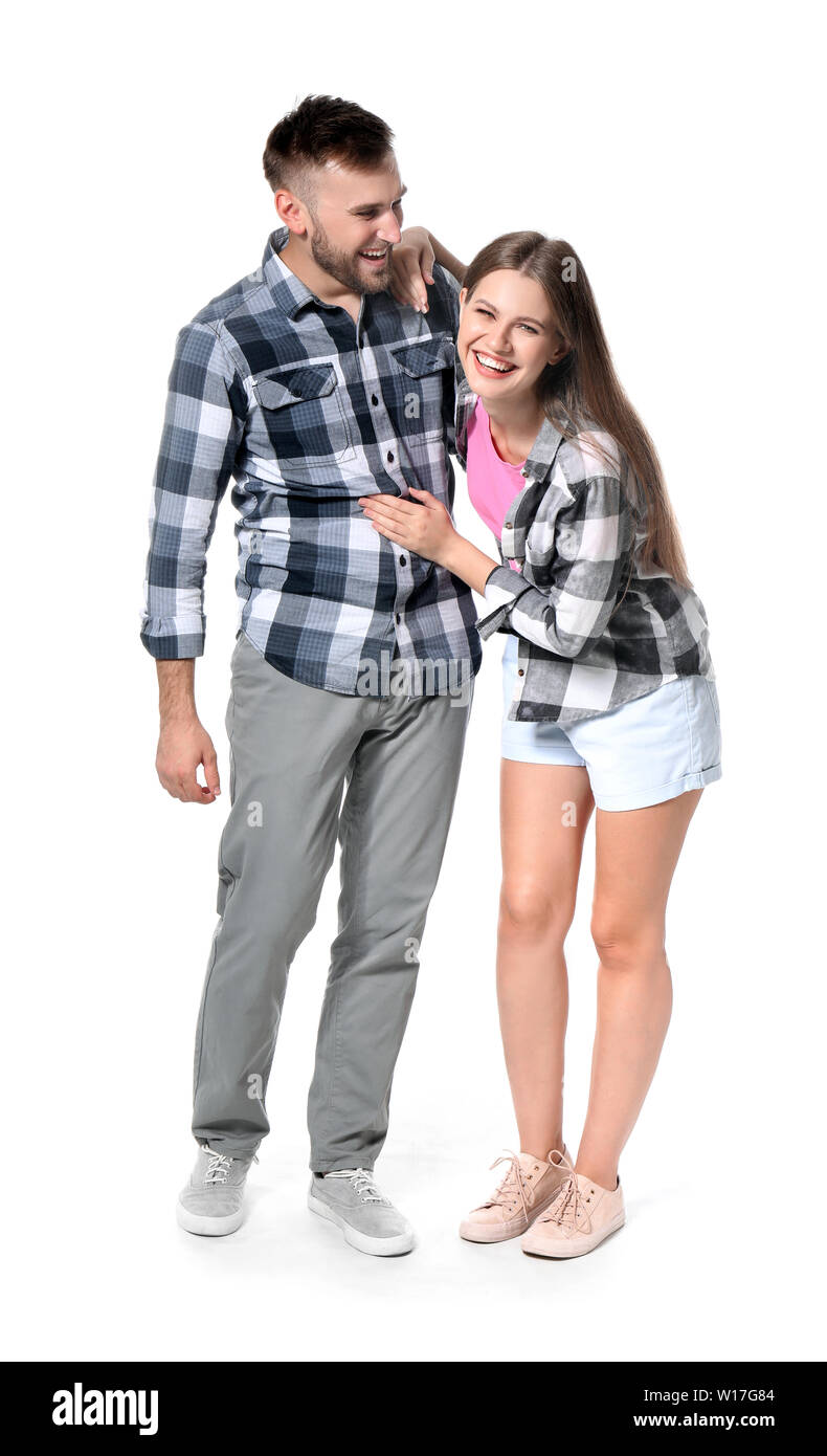 Portrait of happy young couple on white background Stock Photo - Alamy
