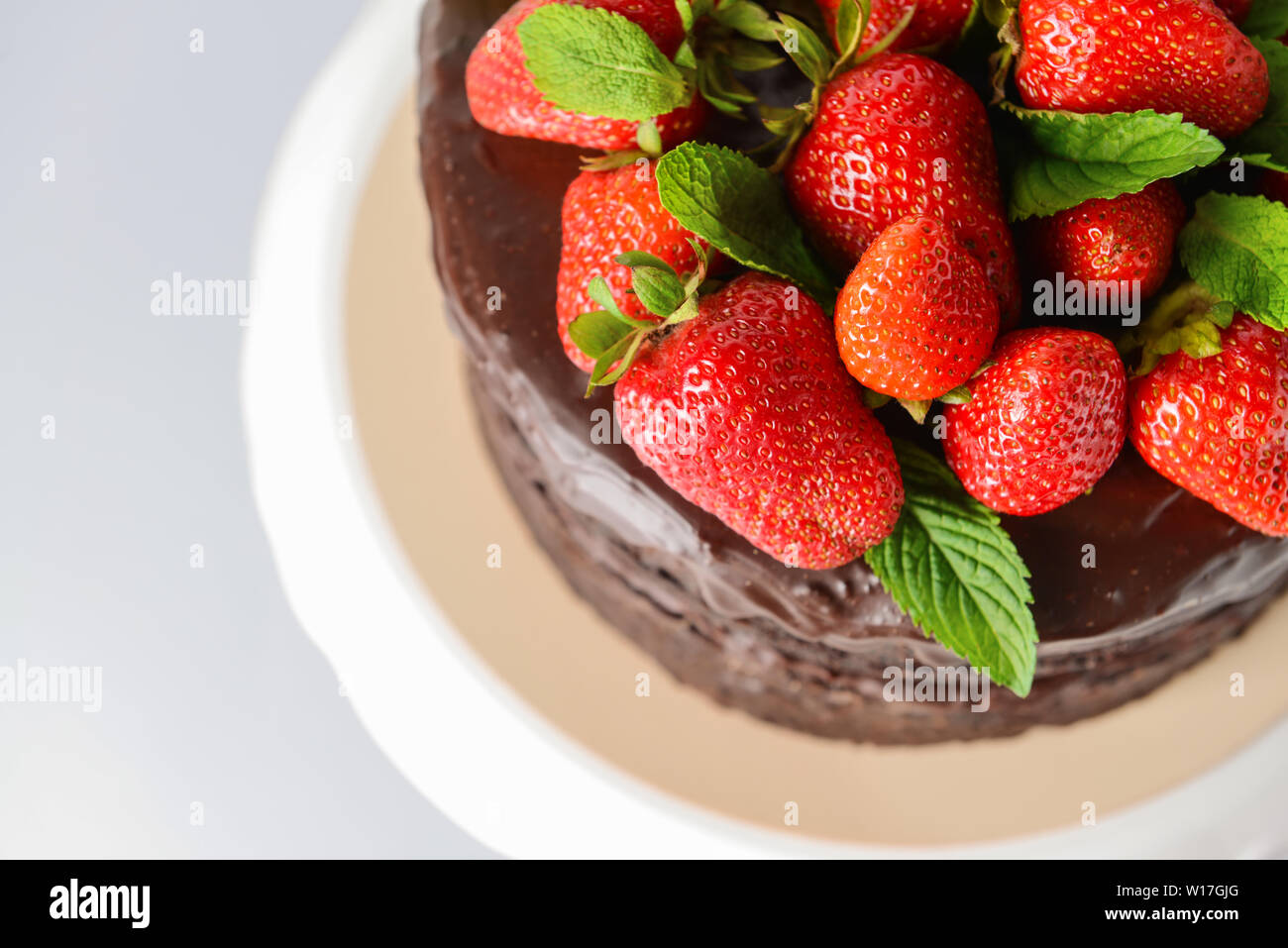 Tasty chocolate cake with strawberry on white background, closeup Stock ...