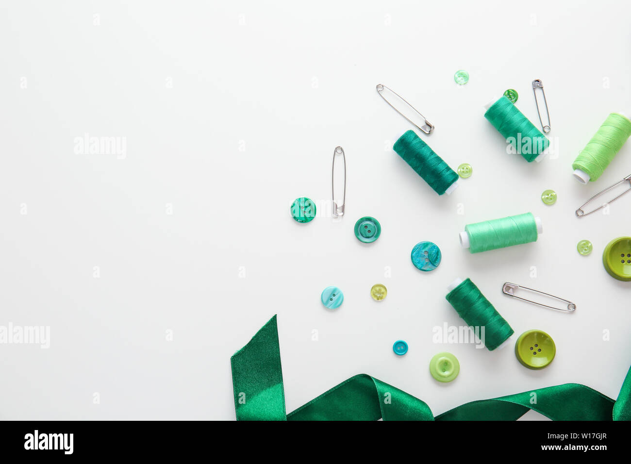 Set of sewing threads and accessories on white background Stock Photo ...