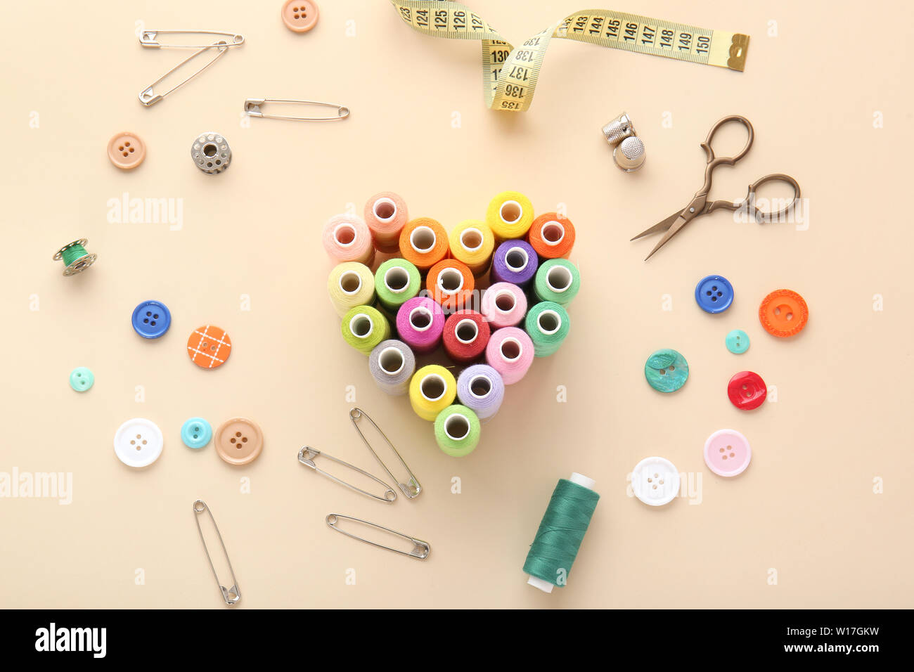 Set of sewing threads and accessories on light background Stock Photo ...