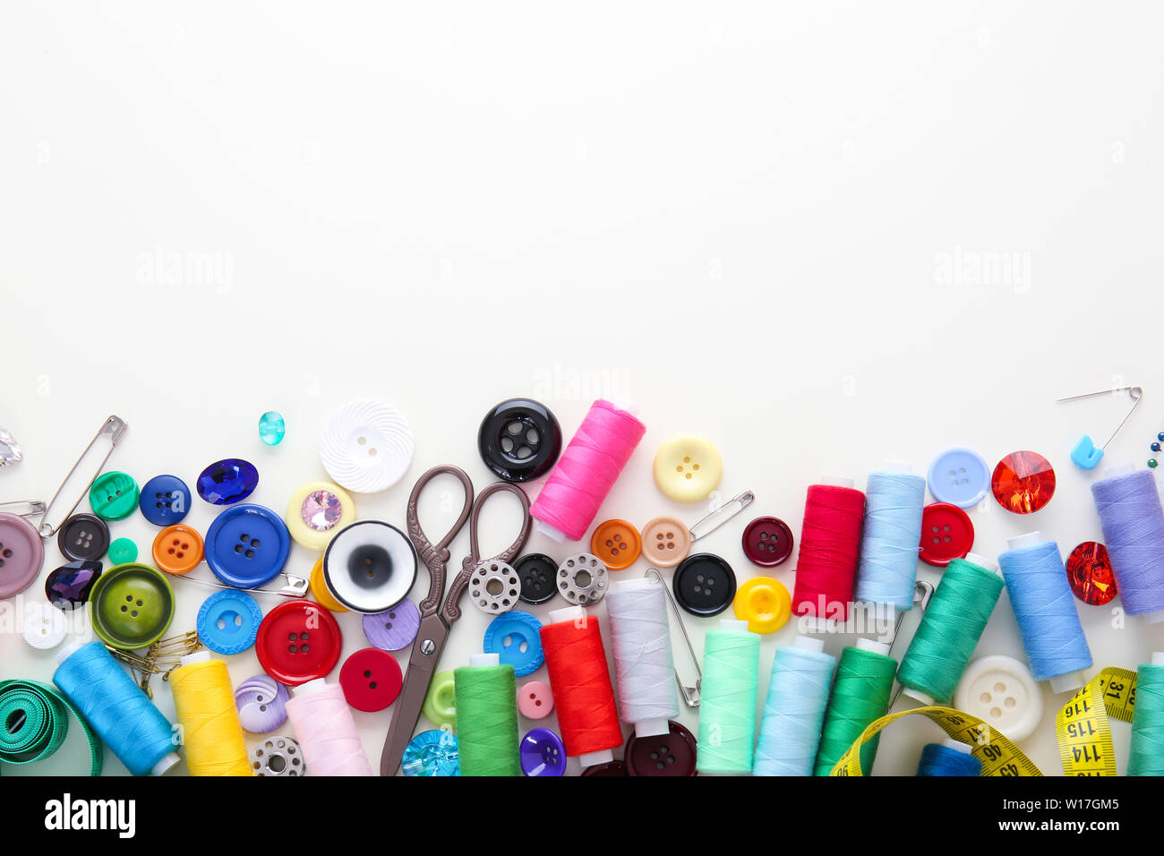 Set of sewing threads and accessories on white background Stock Photo ...