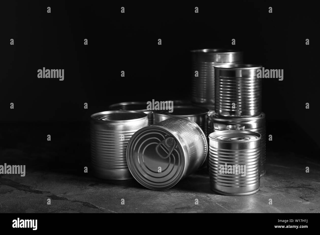 Tin cans with food on dark background Stock Photo Alamy