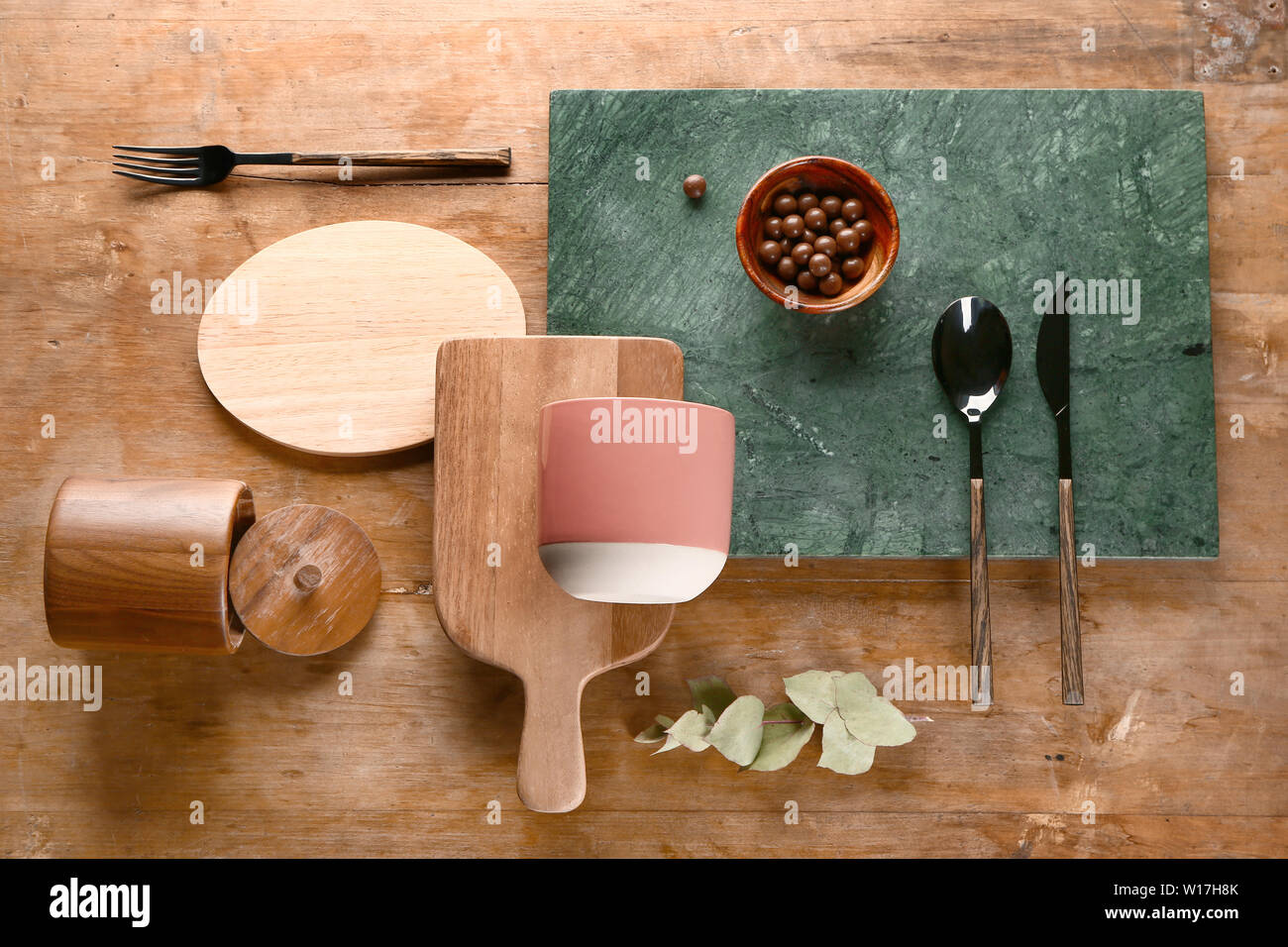 Different kitchenware on wooden background Stock Photo - Alamy