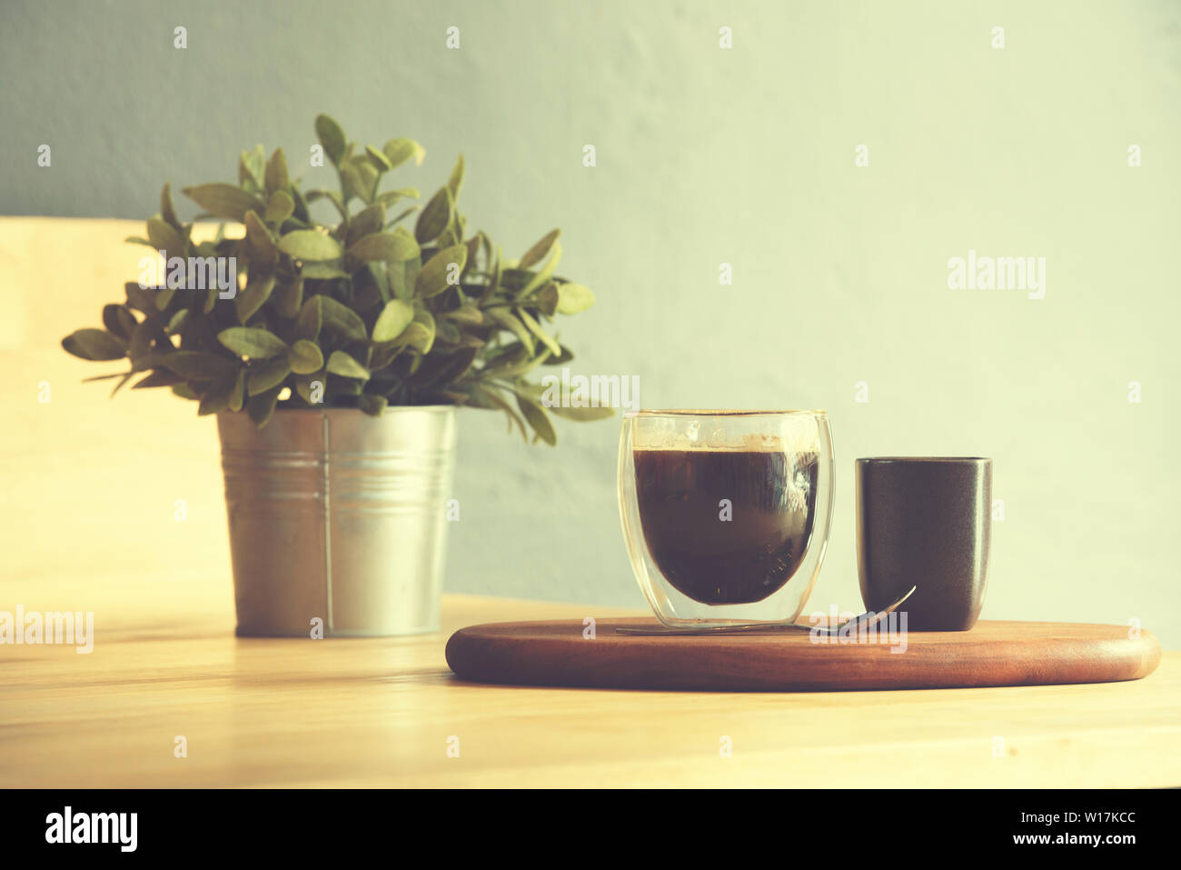 Coffee cup on a wooden table and sack background,Vintage color tone Stock Photo
