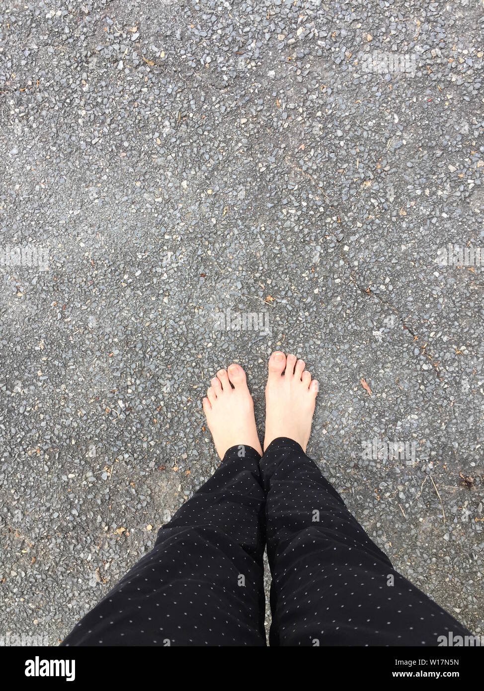 Walking Barefoot On Asphalt High Resolution Stock Photography and