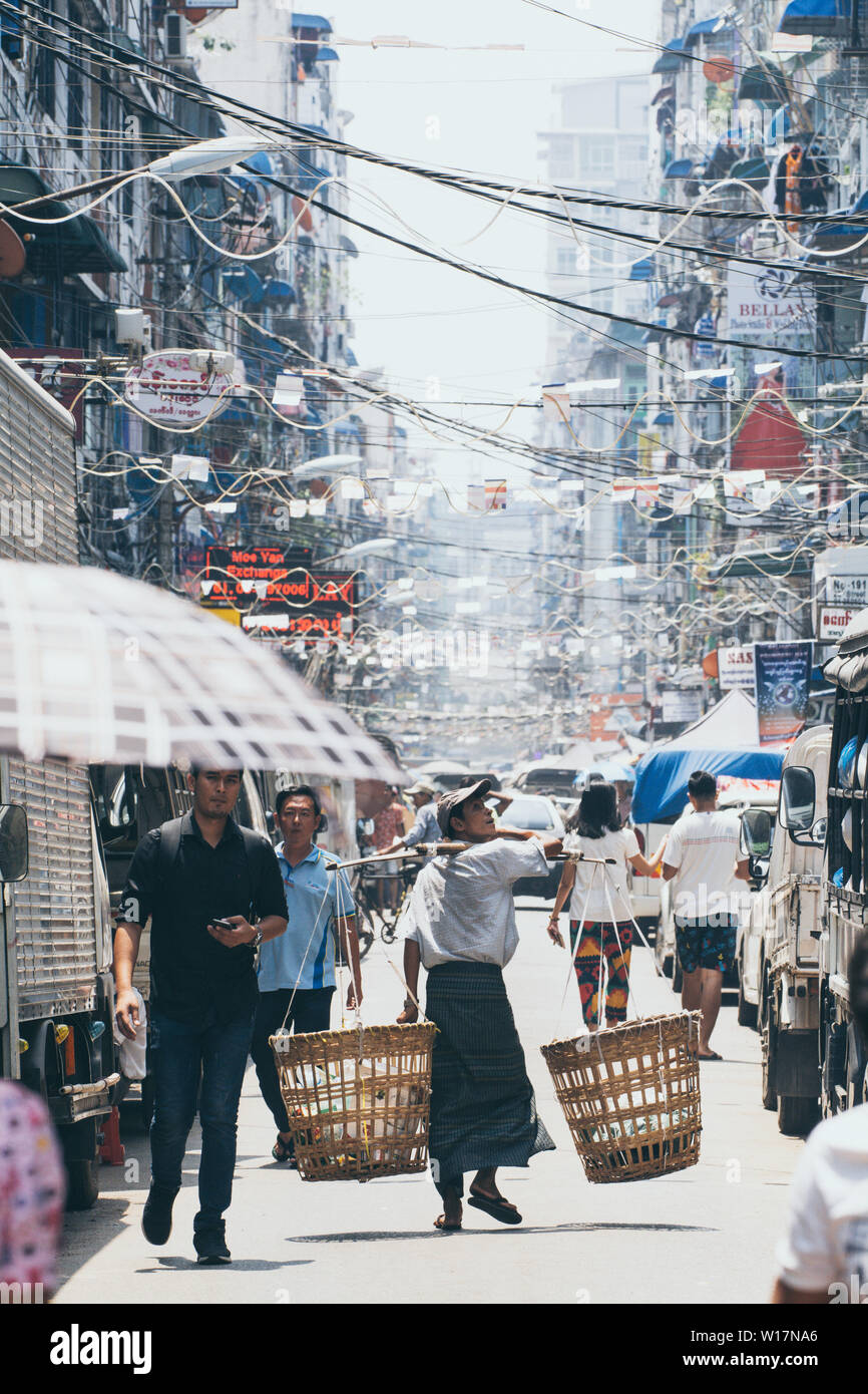 Yangon, Myanmar - March 2019: street view in the old town district. Vertical orientation. Stock Photo