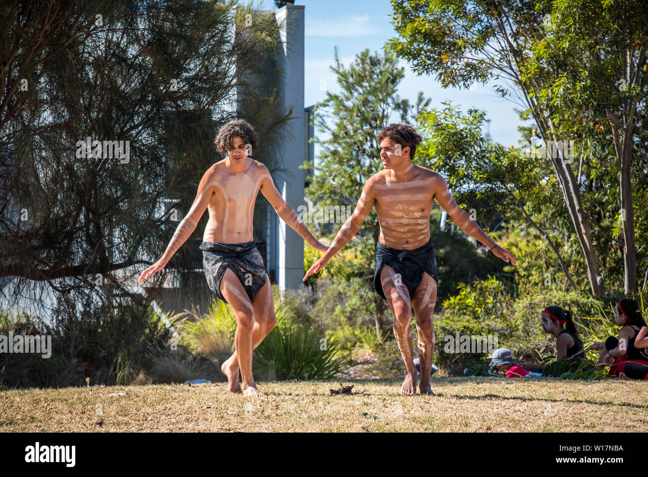 Where modern meets ancient. Traditional Aboriginal dance presentation in 39 degrees heat at Portland Victoria. Stock Photo
