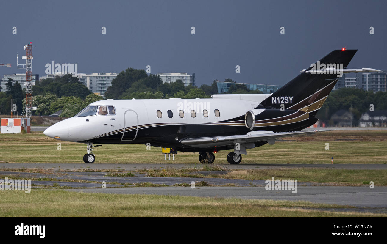 Richmond, British Columbia, Canada. 23rd June, 2019. A BAE 125-800A (N12SY) private business jet taxiing along the tarmac at Vancouver International Airport. Credit: Bayne Stanley/ZUMA Wire/Alamy Live News Stock Photo