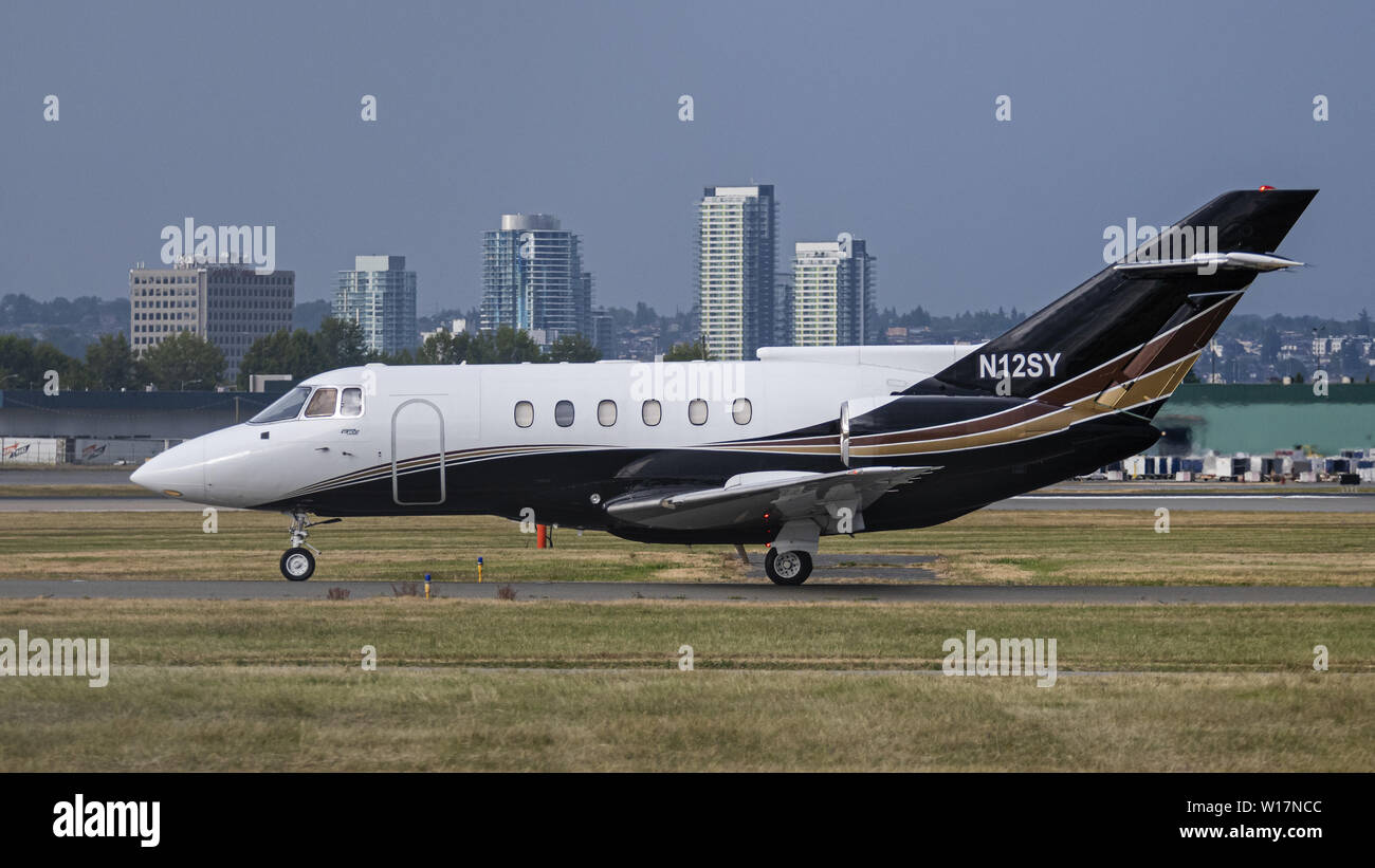 Richmond, British Columbia, Canada. 23rd June, 2019. A BAE 125-800A (N12SY) private business jet taxiing along the tarmac at Vancouver International Airport. Credit: Bayne Stanley/ZUMA Wire/Alamy Live News Stock Photo