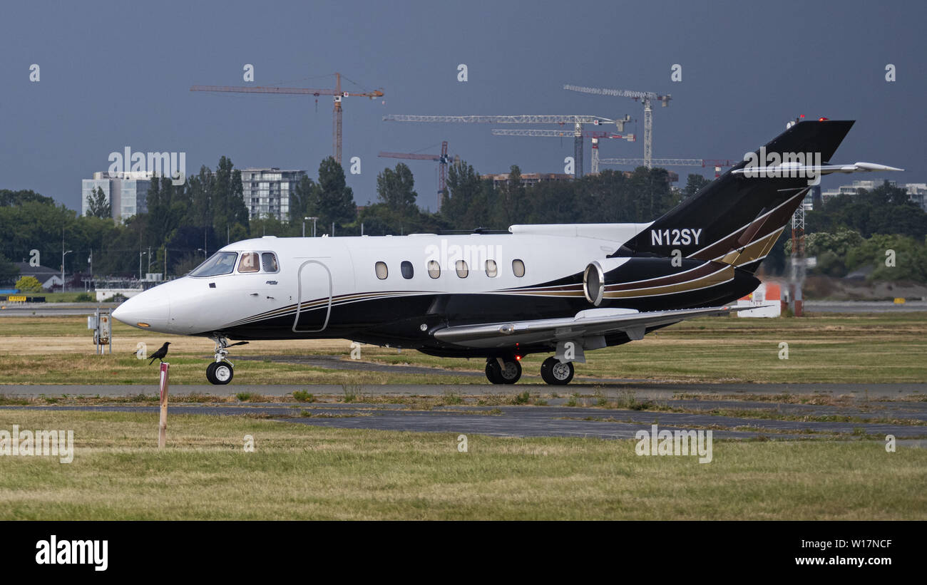 Richmond, British Columbia, Canada. 23rd June, 2019. A BAE 125-800A (N12SY) private business jet taxiing along the tarmac at Vancouver International Airport. Credit: Bayne Stanley/ZUMA Wire/Alamy Live News Stock Photo