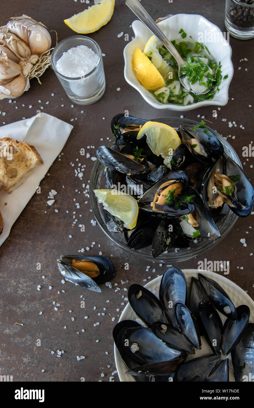 Cooked delicious black mussel with toasted bread and tasty sauce. Healthy eating concept, rich