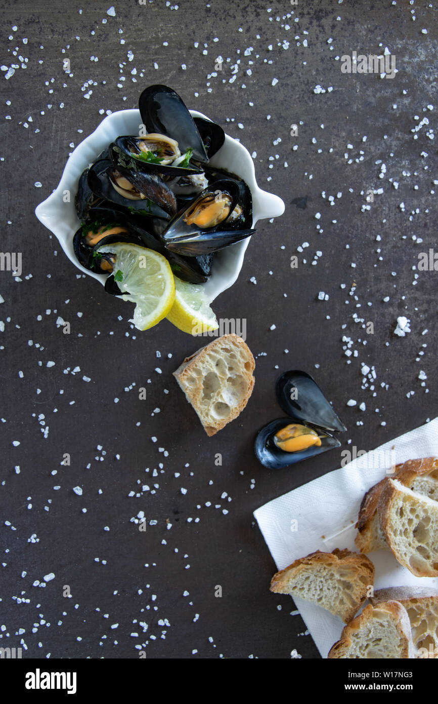 Cooked delicious black mussel with toasted bread. Healthy eating