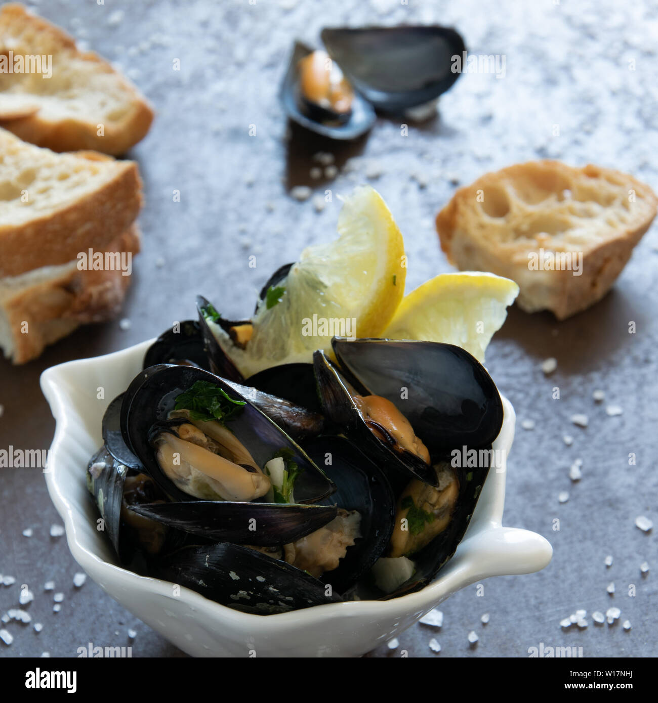 Cooked delicious black mussel with toasted bread. Healthy eating