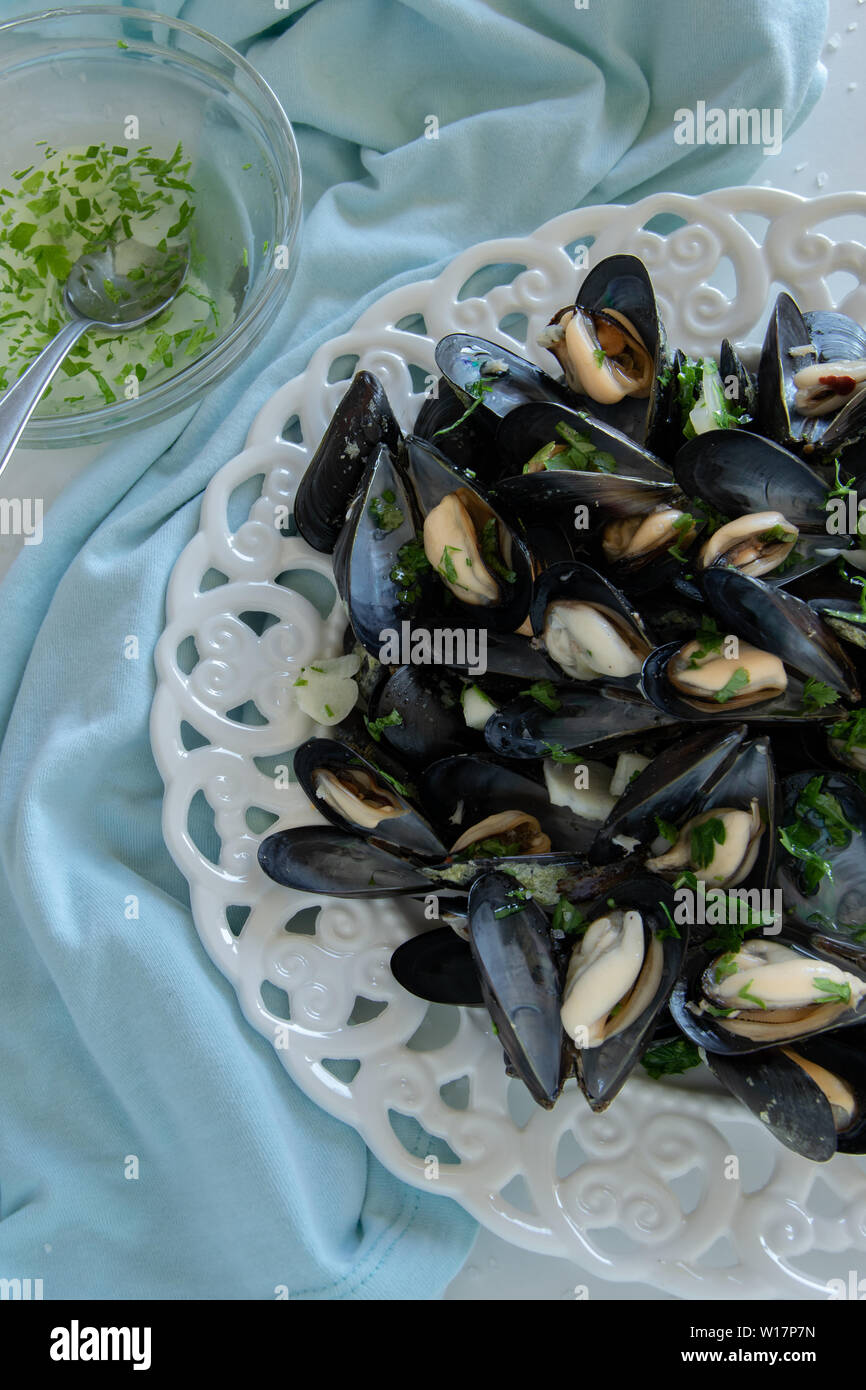 Cooked delicious black mussel, salty white background. Healthy eating ...
