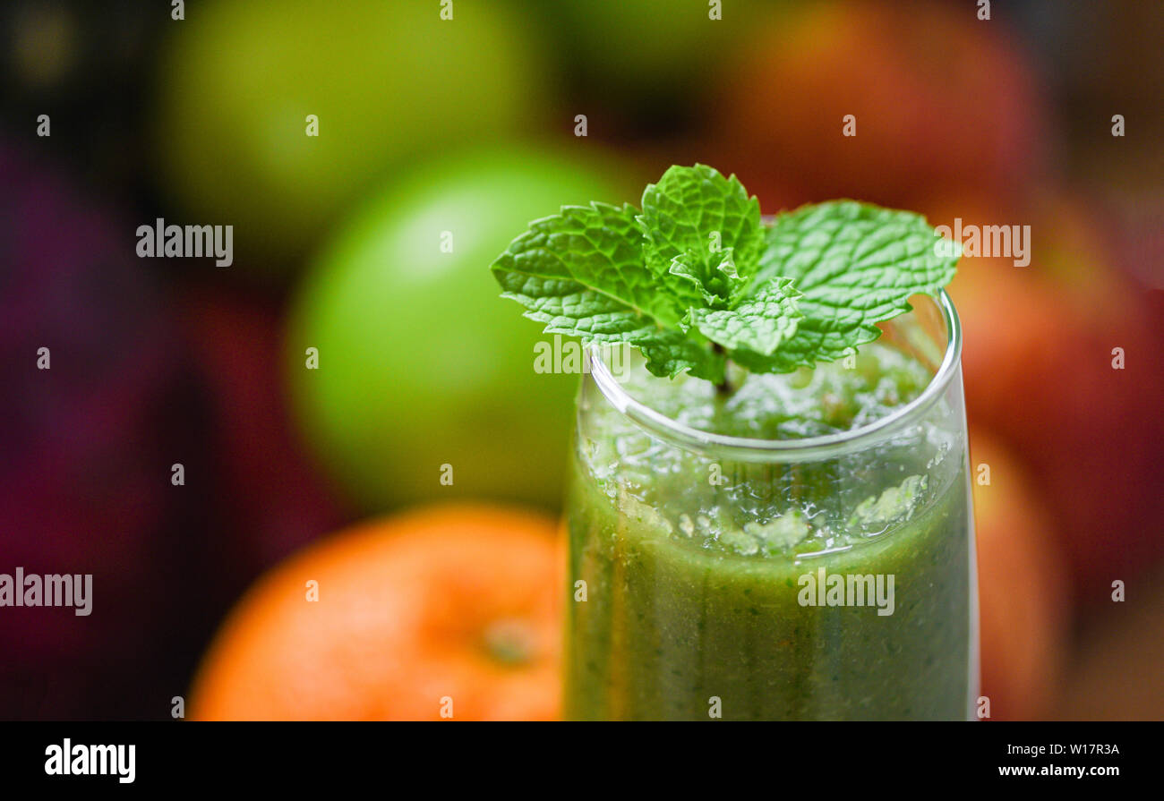 peppermint tea / green mint leaf on fresh vegetable juice smoothie and