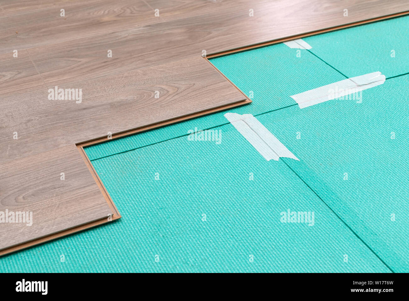 Photo inspiration: Picture Idea: Craftsman Installing Laminate Flooring In New Apartment Stock Photo