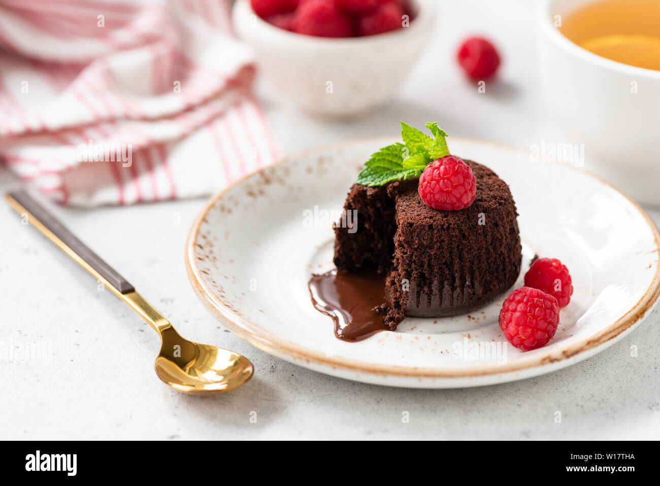 Tasty Chocolate Dessert Fondant Or Lava Cake With Fresh Raspberries. Closeup View Stock Photo