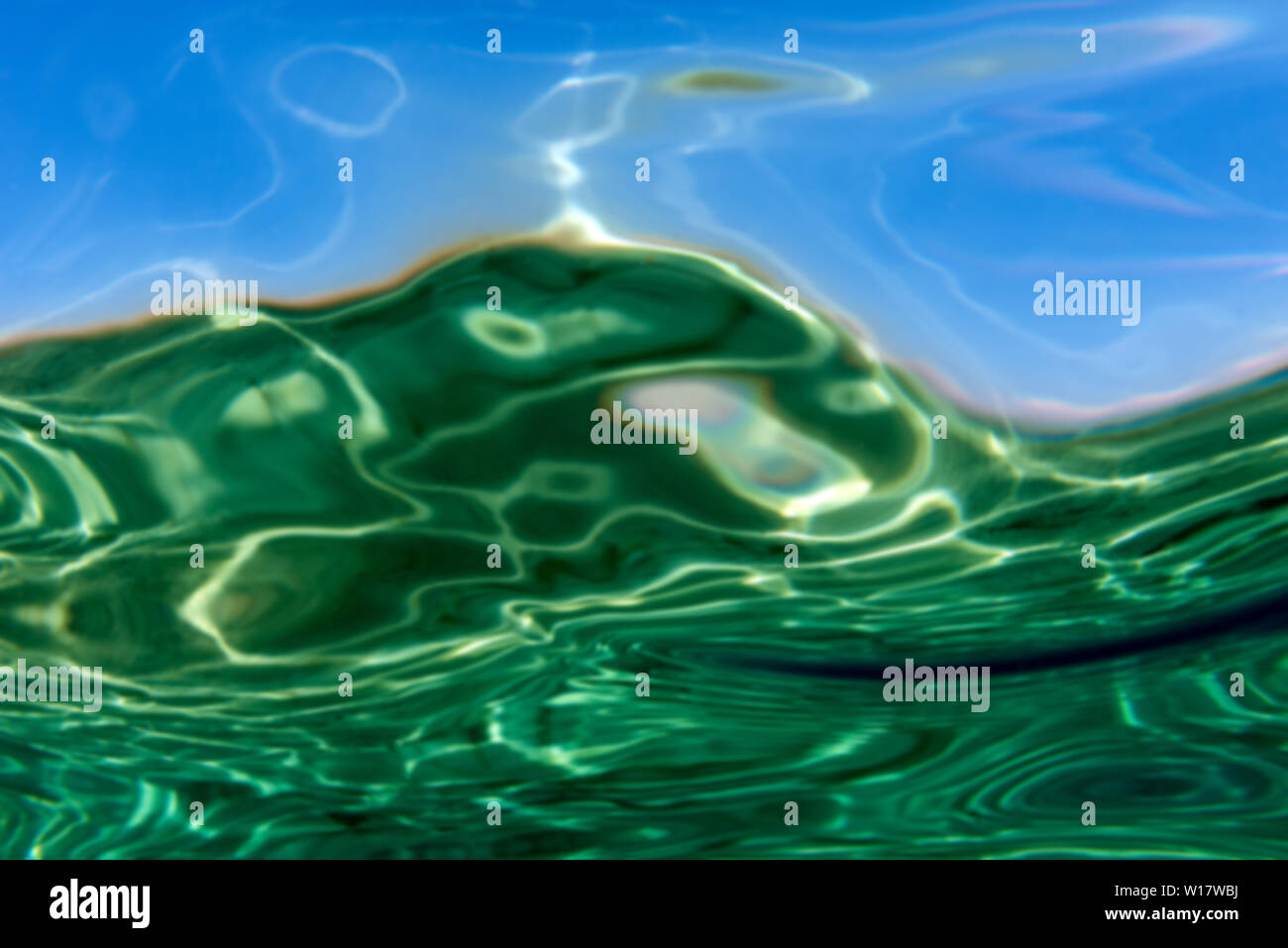 Summer time under the sea ocean water with a ray of sunlight from the surface for a background concept design Stock Photo