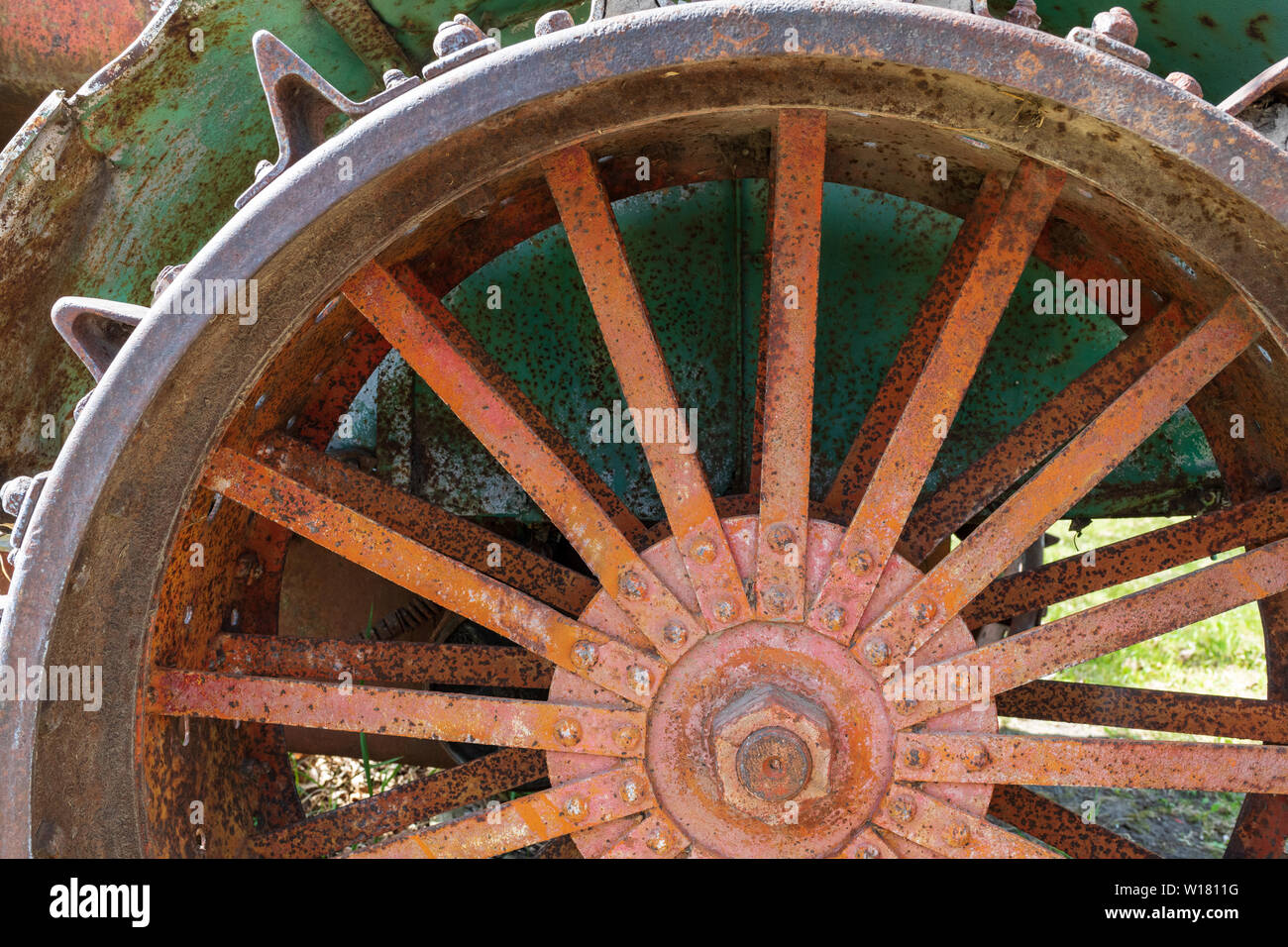 Rusty spokes of a wheel on an antique tractor Stock Photo Alamy