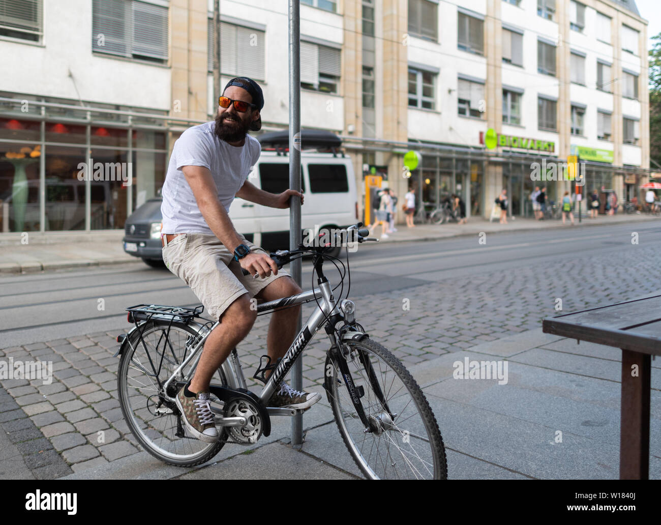 18 June 2019, Saxony, Dresden: Michael Rösch, former biathlete, rides his  bike through the Neustadt. Photo: Robert Michael/dpa-Zentralbild/ZB Stock  Photo - Alamy