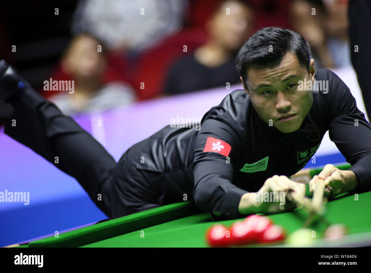 Andy Lee of Hong Kong plays a shot to China A in the quarterfinal match during the Beverly 2019 Snooker World Cup in Wuxi city, east Chinas Jiangsu province, 29 June 2019.