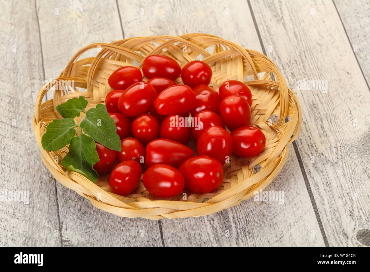 Sweet Red cherry tomatoes in the bowl Stock Photo - Alamy