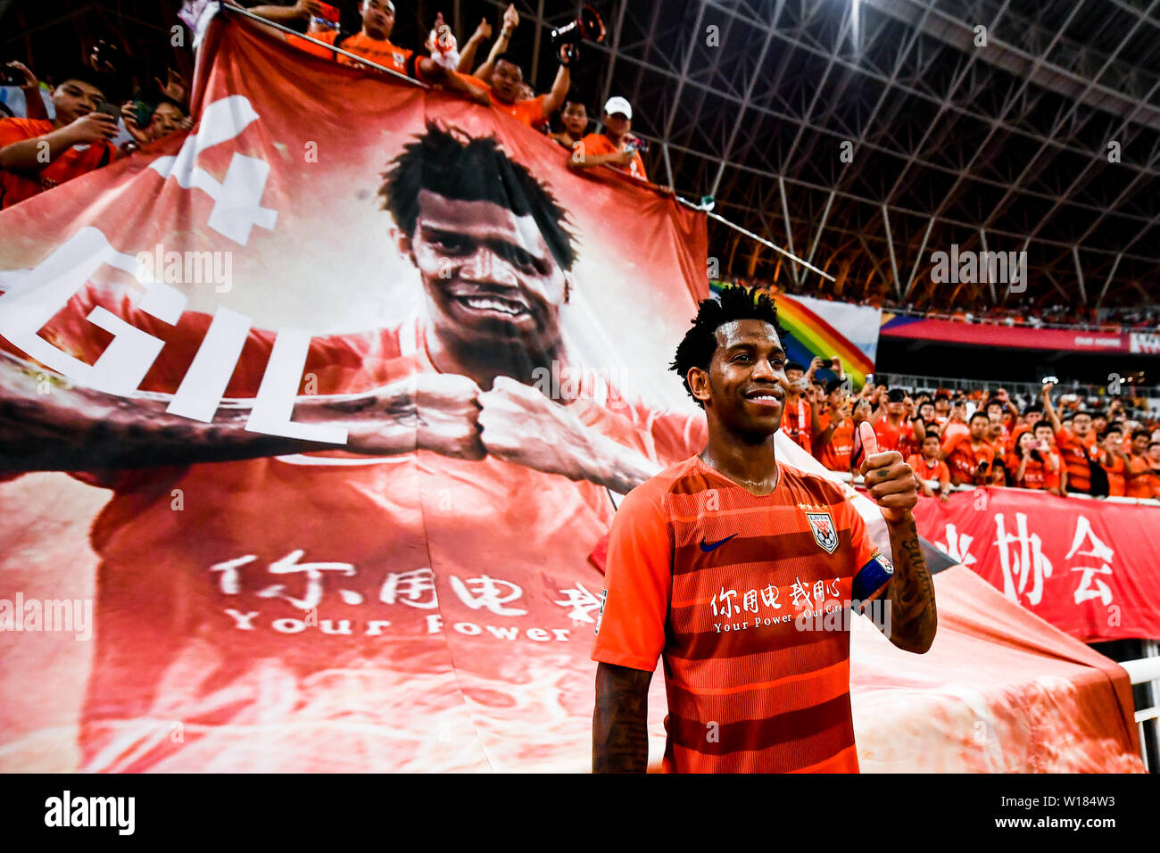 Brazilian football player Carlos Gilberto Nascimento Silva or simply Gil, of Shandong Luneng Taishan poses after their 15th round match against Beijing Sinobo Guoan during the 2019 Chinese Football Association Super League (CSL) in Ji'nan city, east China's Shandong province, 30 June 2019. Stock Photo
