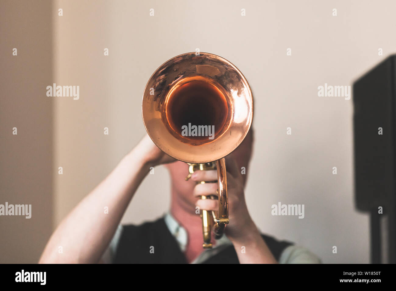 Live music background, Trumpeter with a trumpet in hands, close-up front view photo with selective focus Stock Photo