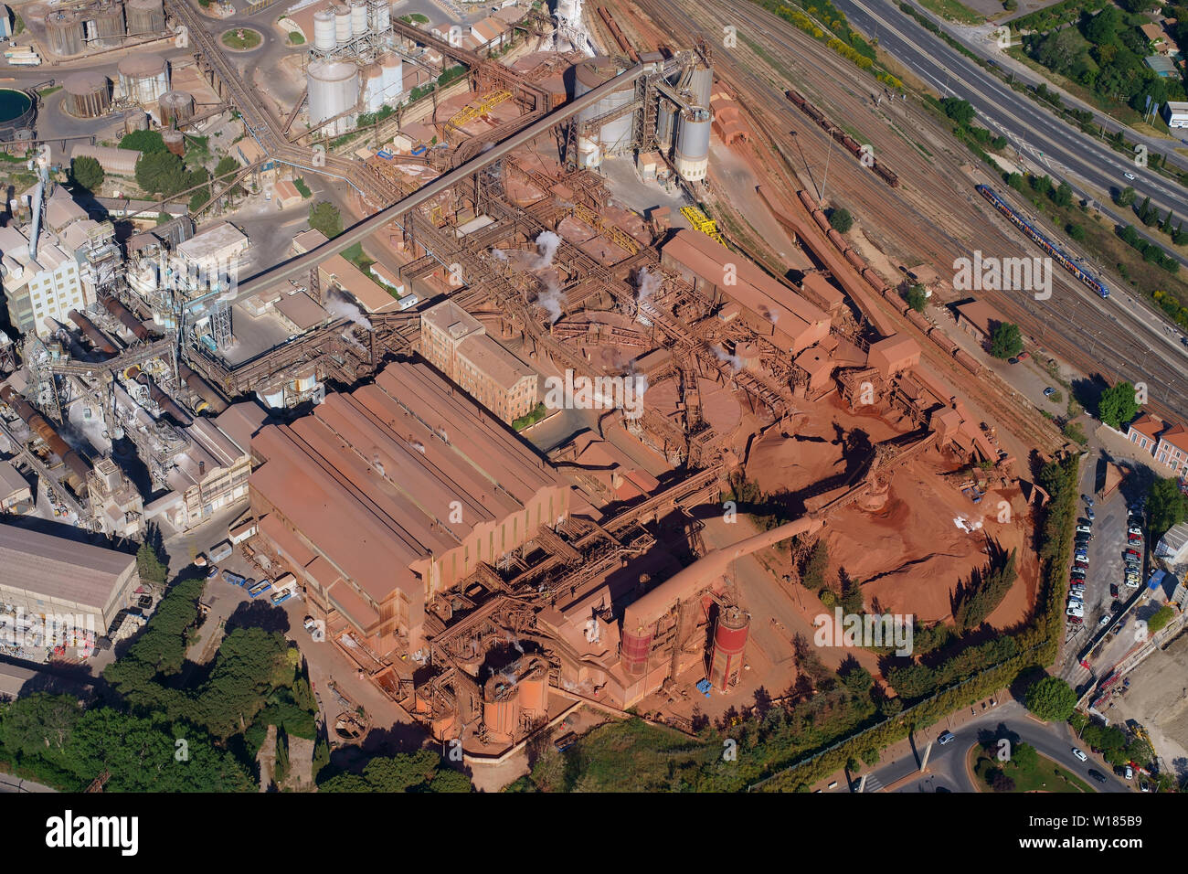 AERIAL VIEW. The Alteo Factory; a worldwide leader in the production of alumina from imported bauxite. Gardanne, Provence, France. Stock Photo