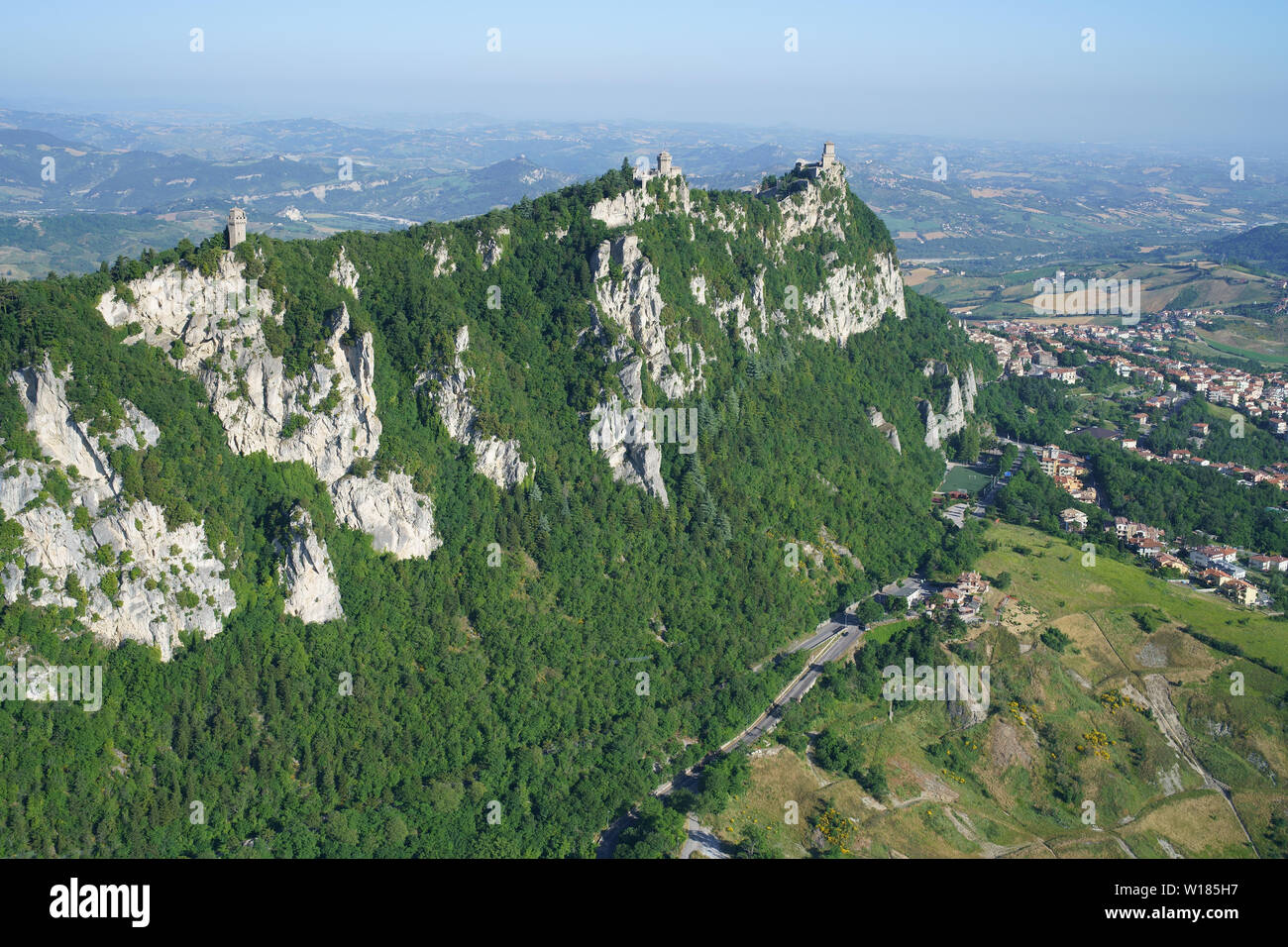AERIAL VIEW. Mount Titano (elevation: 749m) with its three emblematic castle. Republic of San Marino. Stock Photo