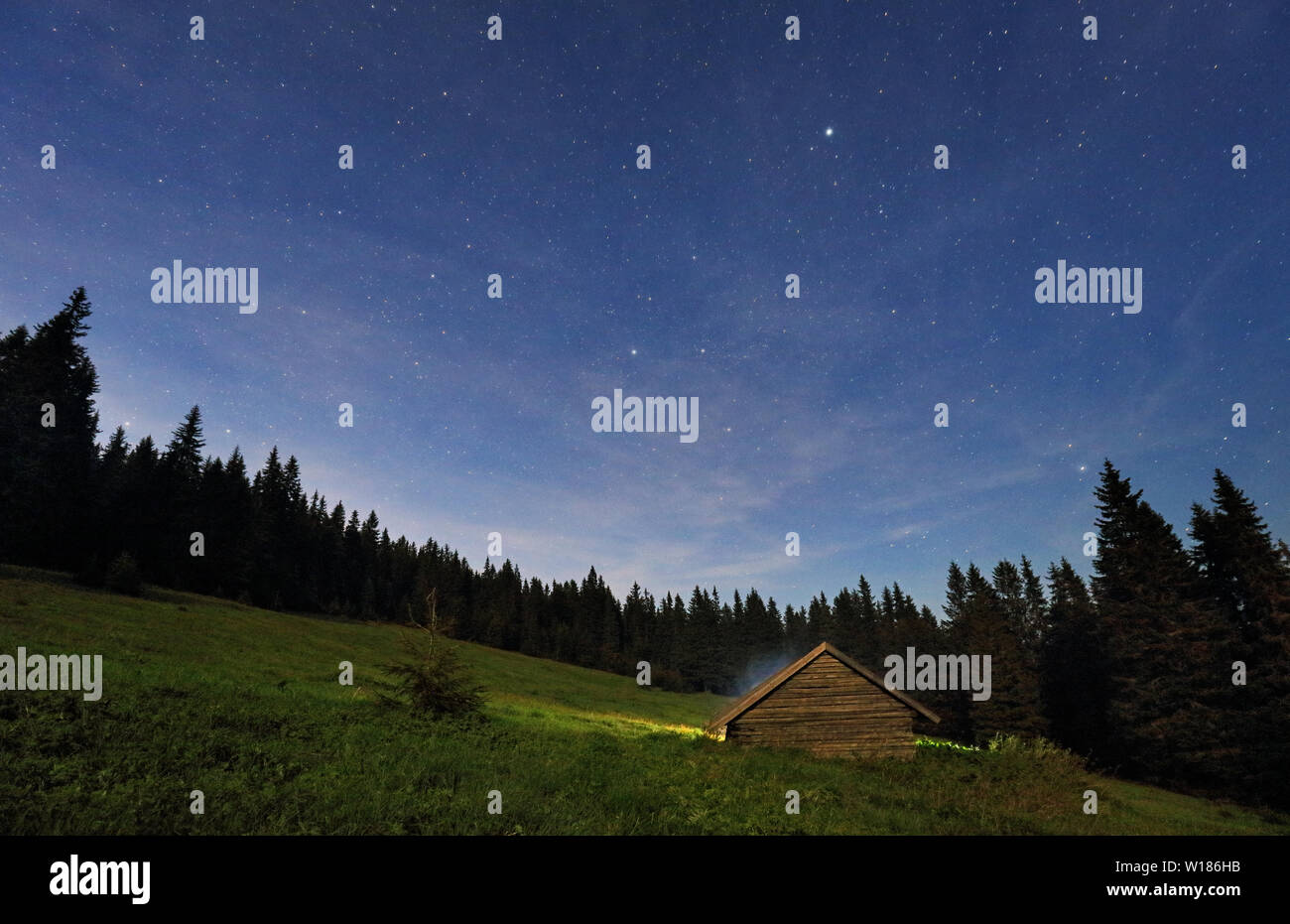 Night view of mountain stars with cottage Stock Photo