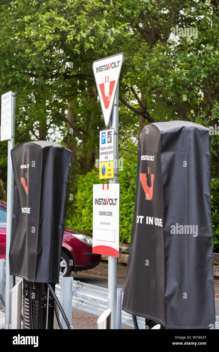 Electric vehicle charging points being installed in the car park of