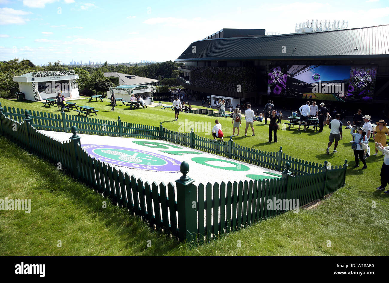 Spectators on Murray mound at the start of day one of the Wimbledon Championships at the All