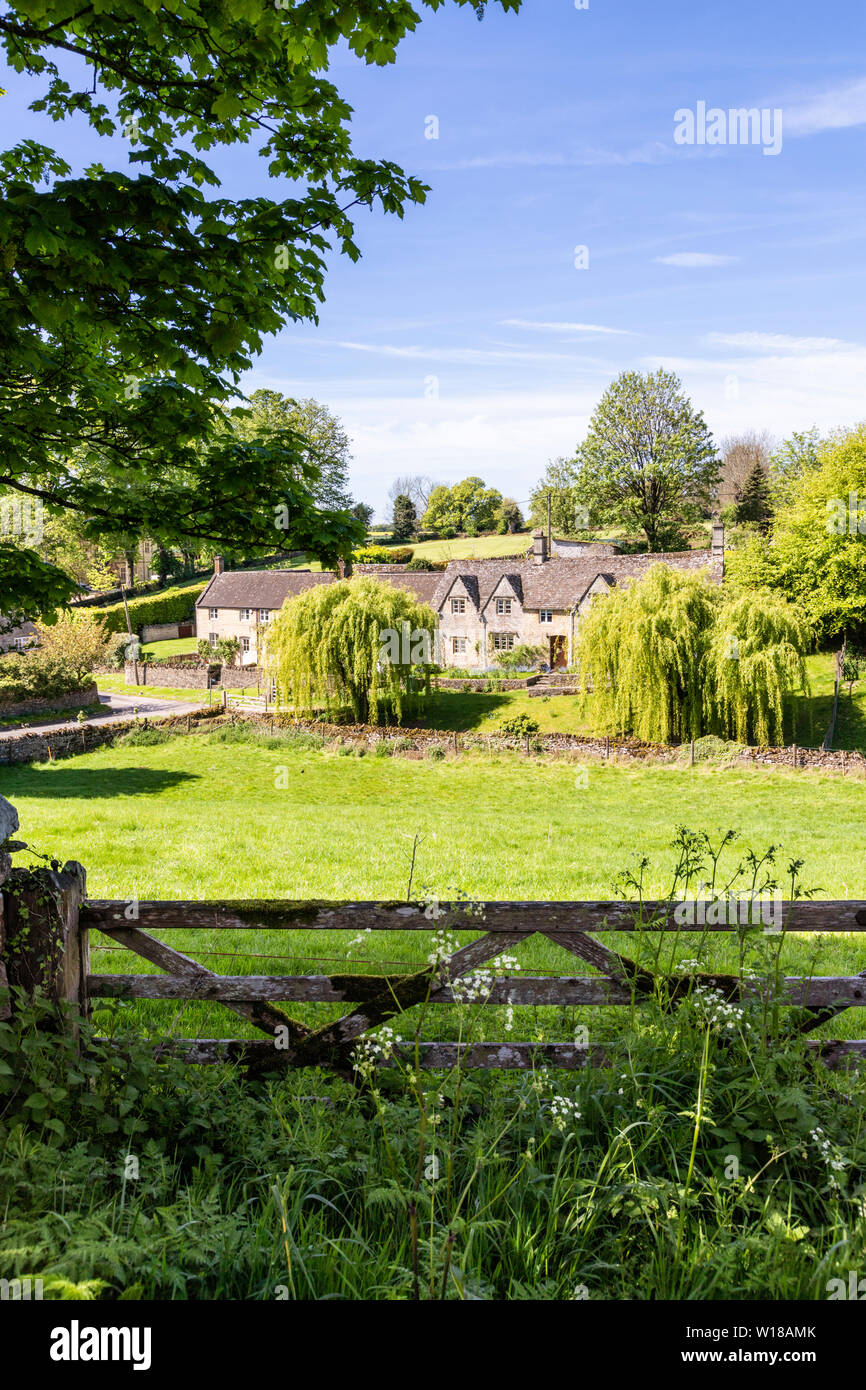 Maytime in the Cotswolds - Stone cottages in the small village of Hampnett, Gloucestershire UK Stock Photo