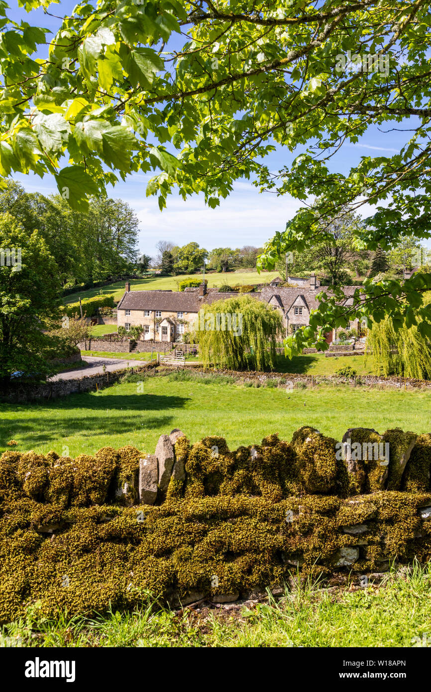 Maytime in the Cotswolds - Stone cottages in the small village of Hampnett, Gloucestershire UK Stock Photo