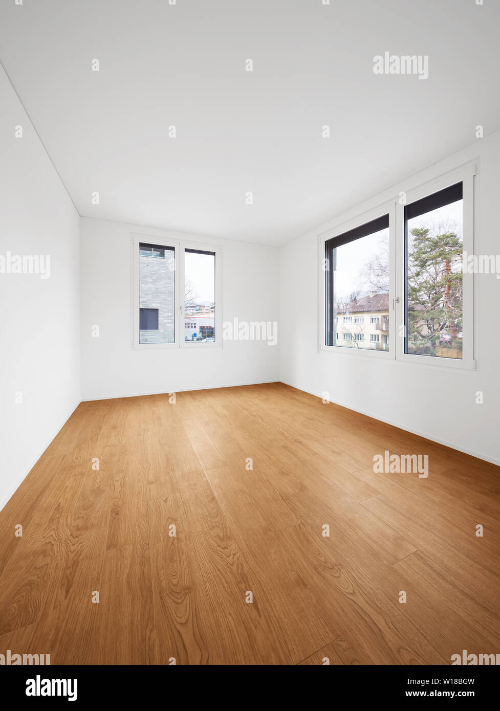 Interior of modern apartment with wooden floor Stock Photo - Alamy