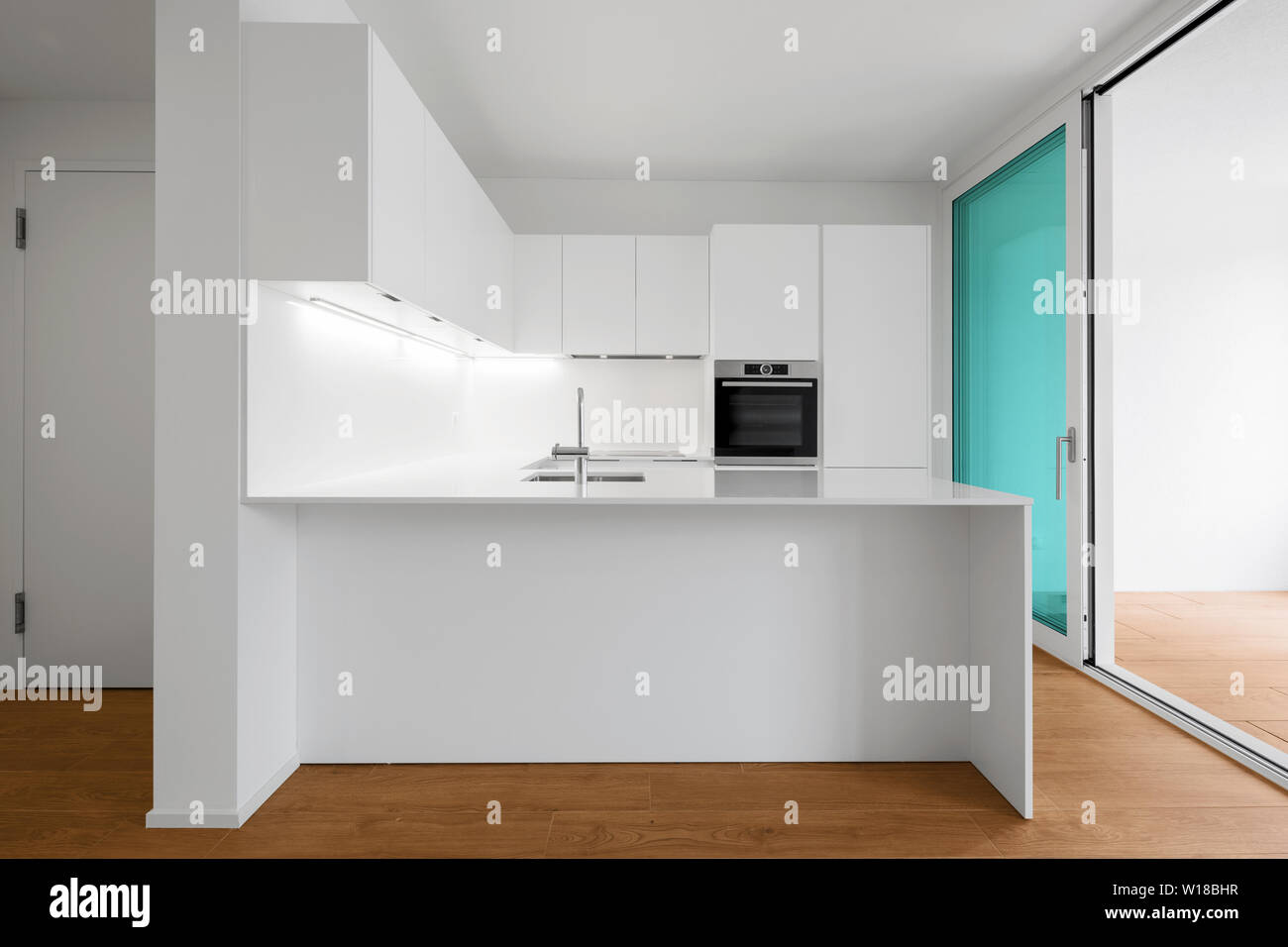 Interior of modern apartment with wooden floor Stock Photo - Alamy