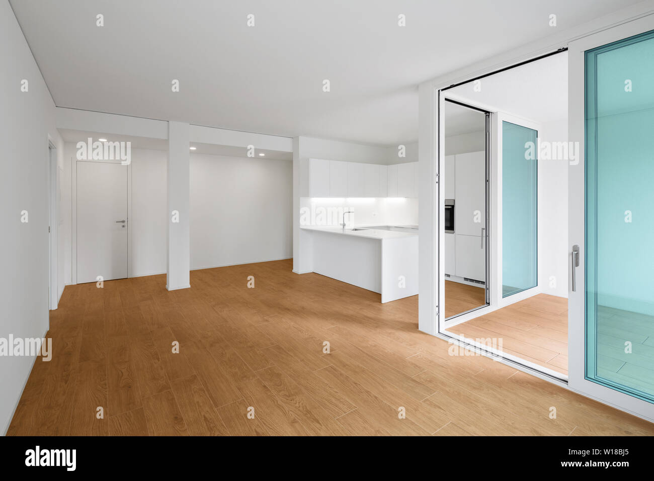 Interior of modern apartment with wooden floor Stock Photo - Alamy