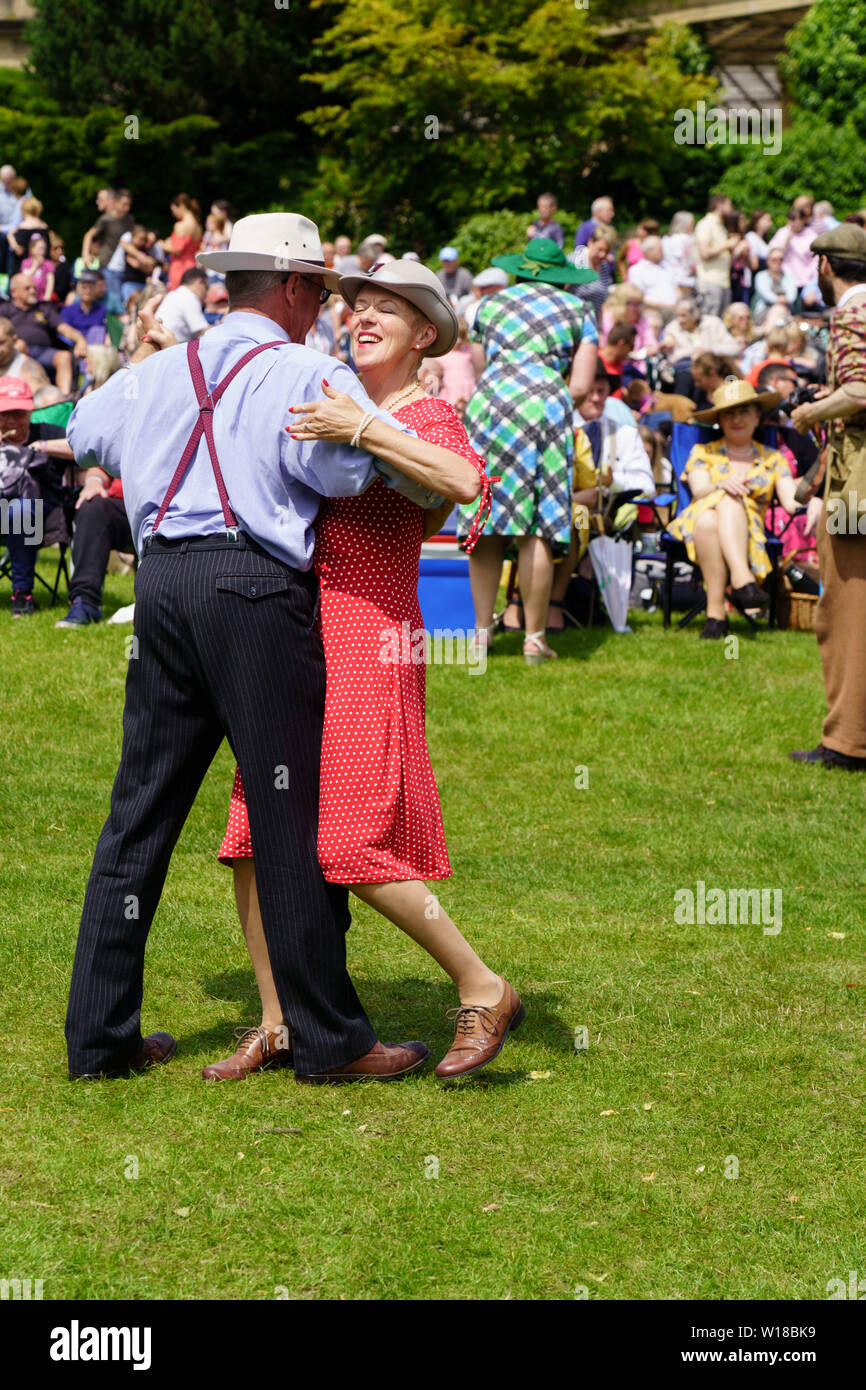 Couple dancing close together a The 1940's Day, Valley Gardens, Harrogate, North Yorkshire, England, UK. Stock Photo