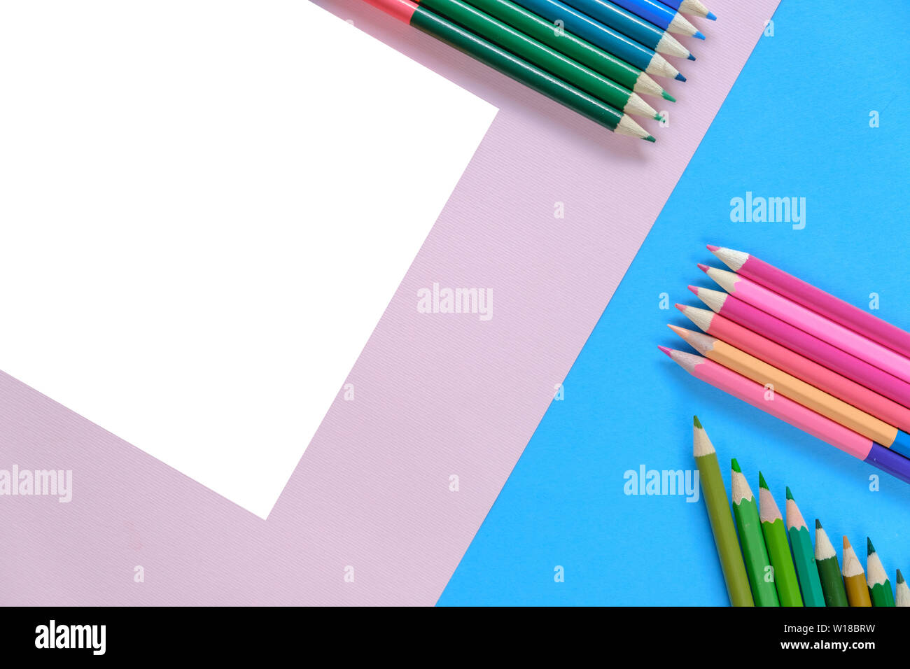 Creative flat lay back to school concept with colored pencils on blue ...
