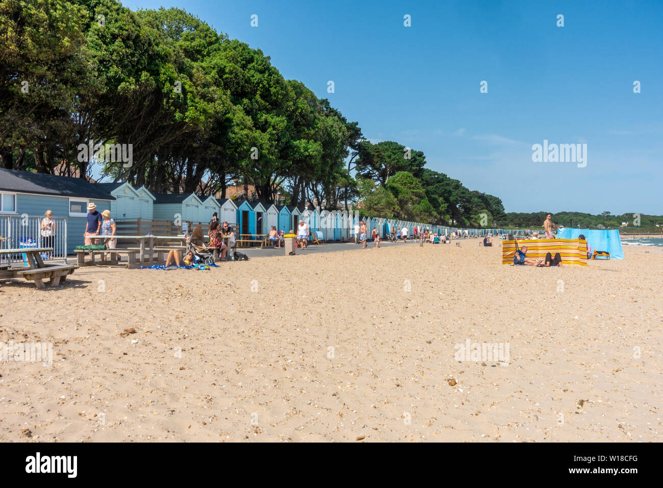 A view of Avon beach at Mudeford, Christchurch in Dorset, UK. A sandy beach seen here on a hot, sunny summer day with blue sky Stock Photo