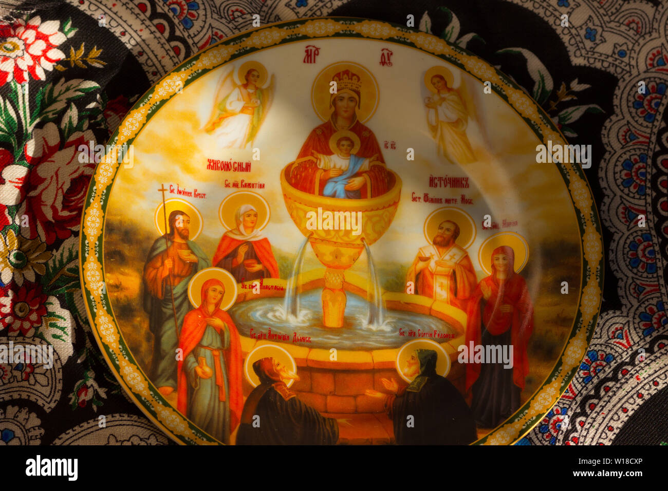 Orthodox icon of the Mother of God 'Life-Giving Source' in the form of a plate on Pavloposadsky shawl 'Mental Conversation' Stock Photo