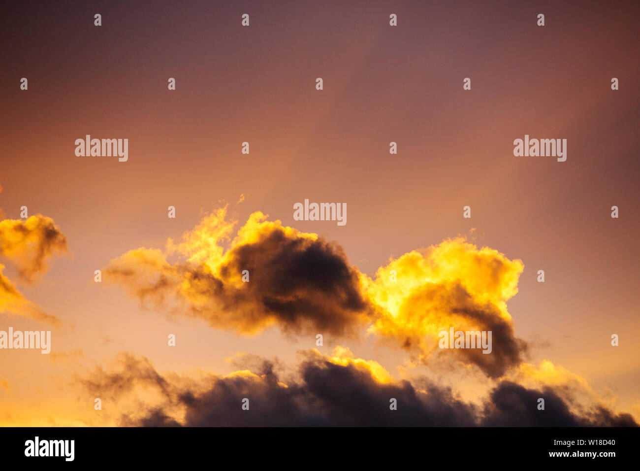 Clouds at sunset over Ambleside during stormy weather, Lake District, UK with Crepuscular rays