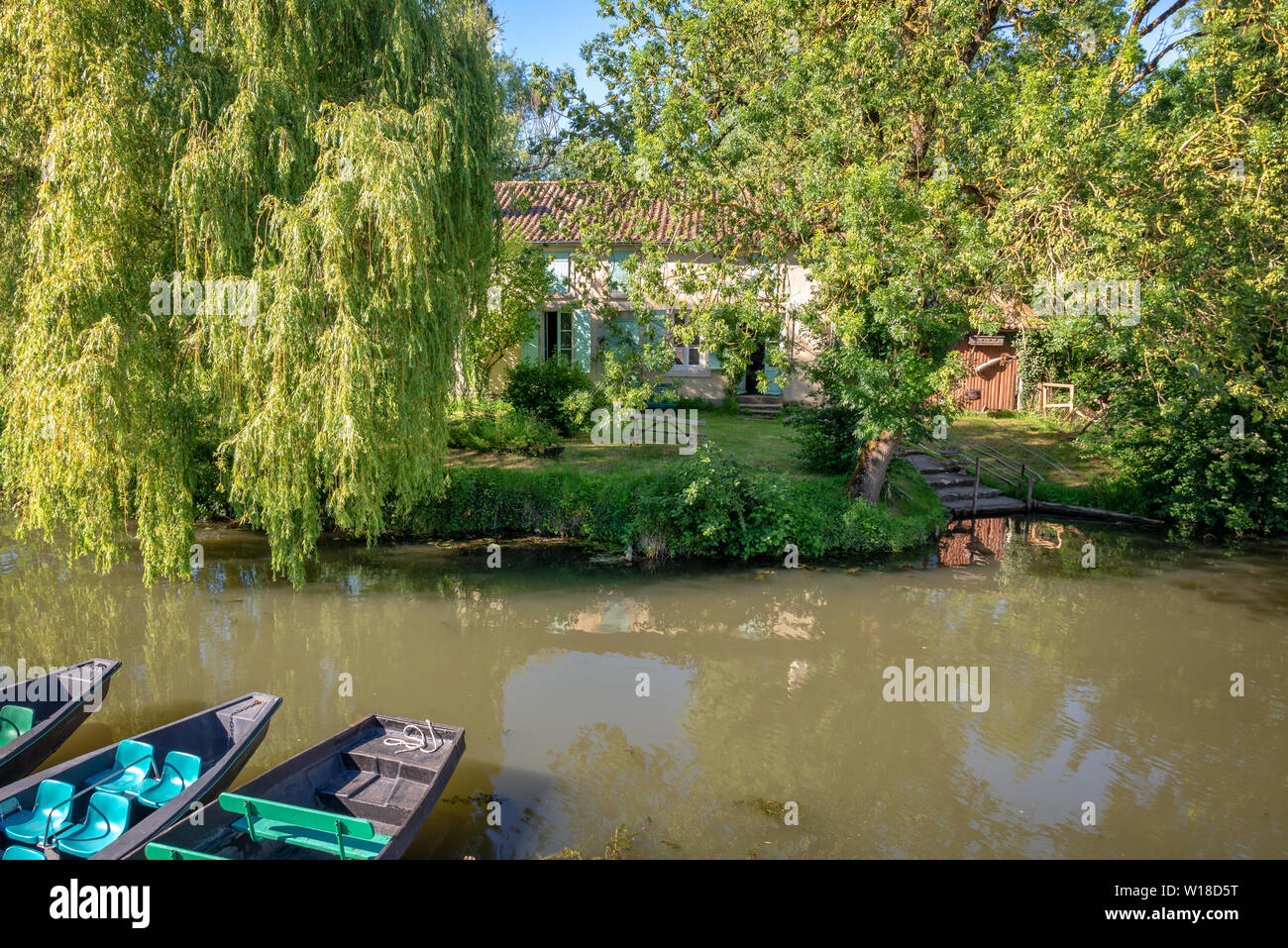 Typical house with a boat pier in the Marais Poitevin, France Stock Photo