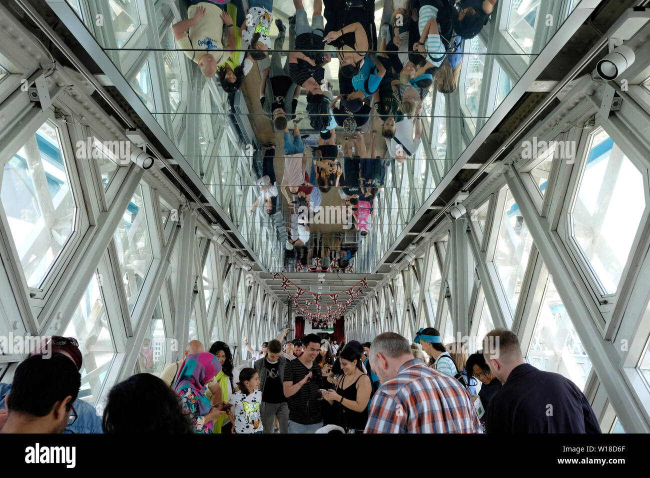 Reflection of people on ceiling, Tower Bridge, London Stock Photo