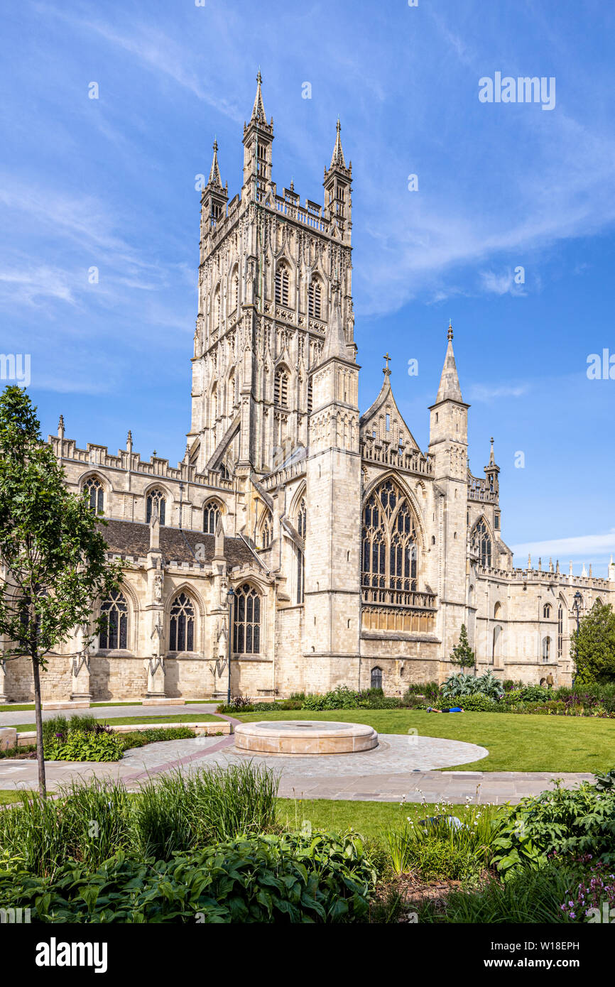 Gloucester Cathedral from the south with its beautifully carved and decorated 15th C tower and the Cathedral Green relandscaped in 2018, Gloucester UK Stock Photo