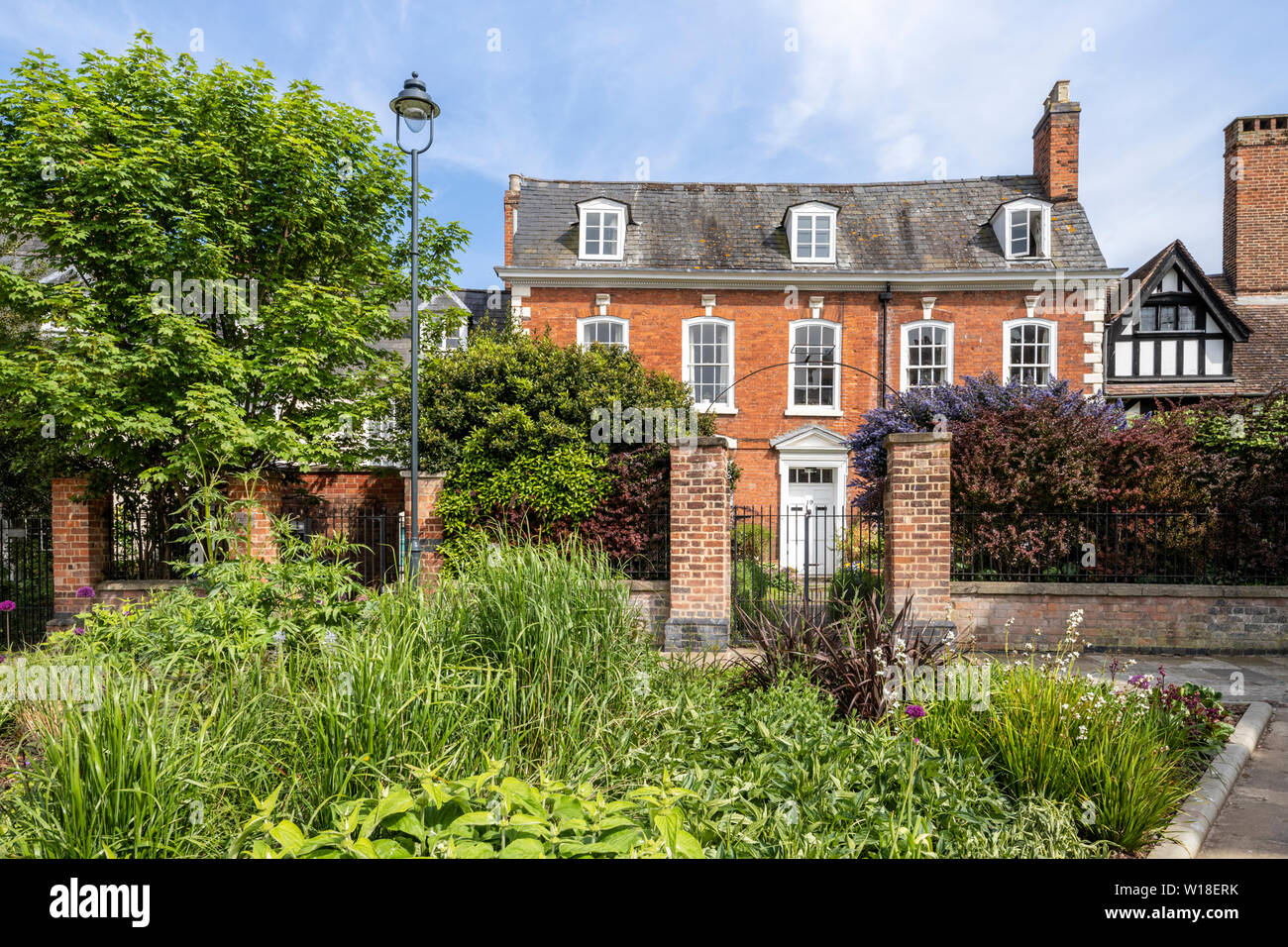 A Georgian property in College Green facing the Cathedral Green re-landscaped in 2018, Gloucester UK Stock Photo