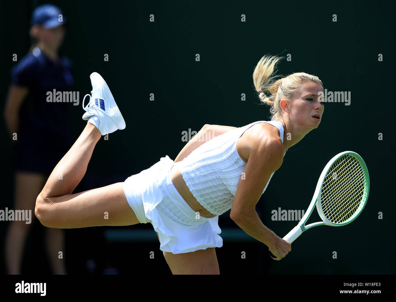 Camila Giorgi in action on day one of the Wimbledon Championships at the All England Lawn Tennis and Croquet Club, London. Stock Photo