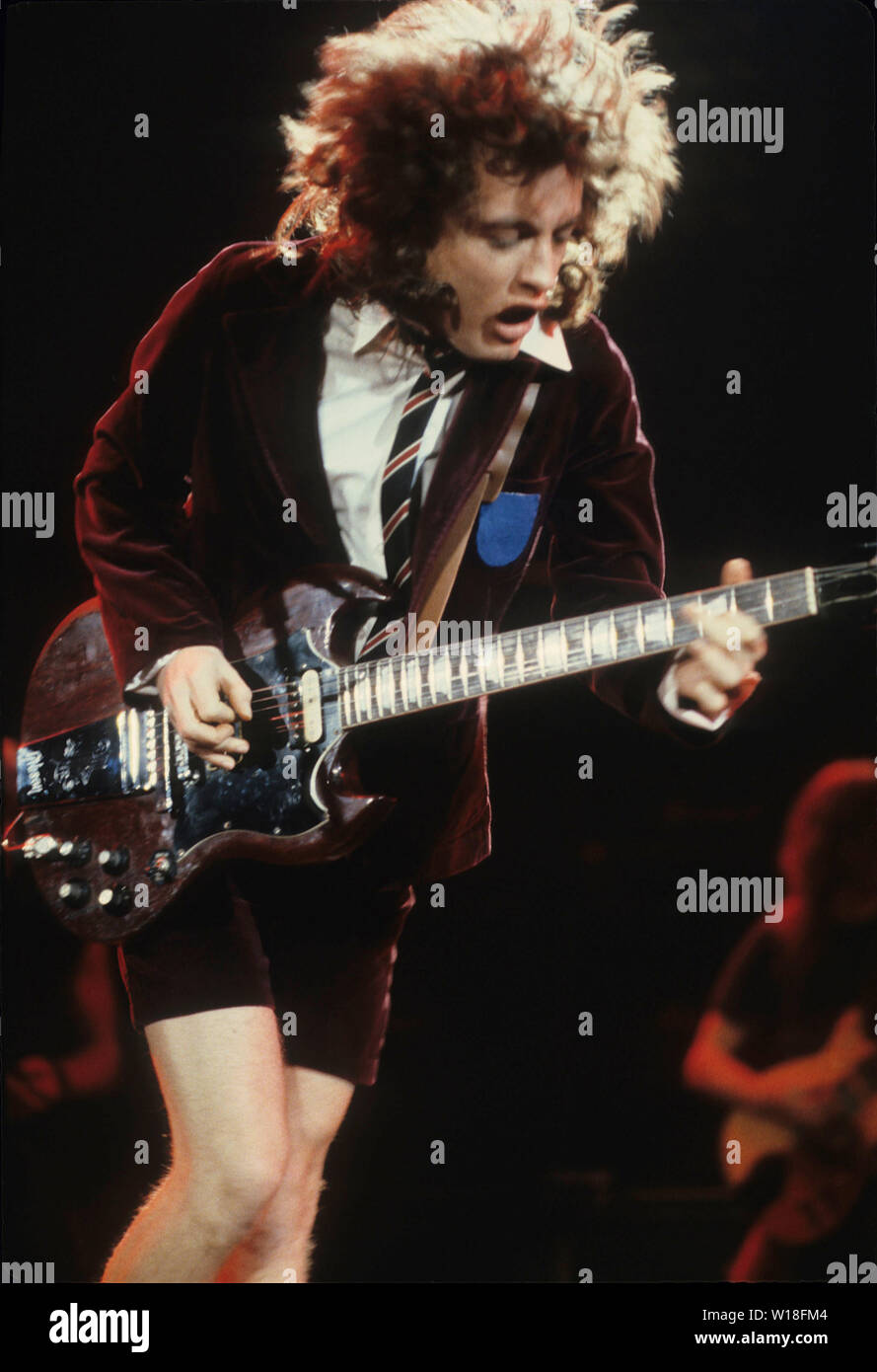 AC/DC US rock group with Angus Young performs about 1983. Photo ...